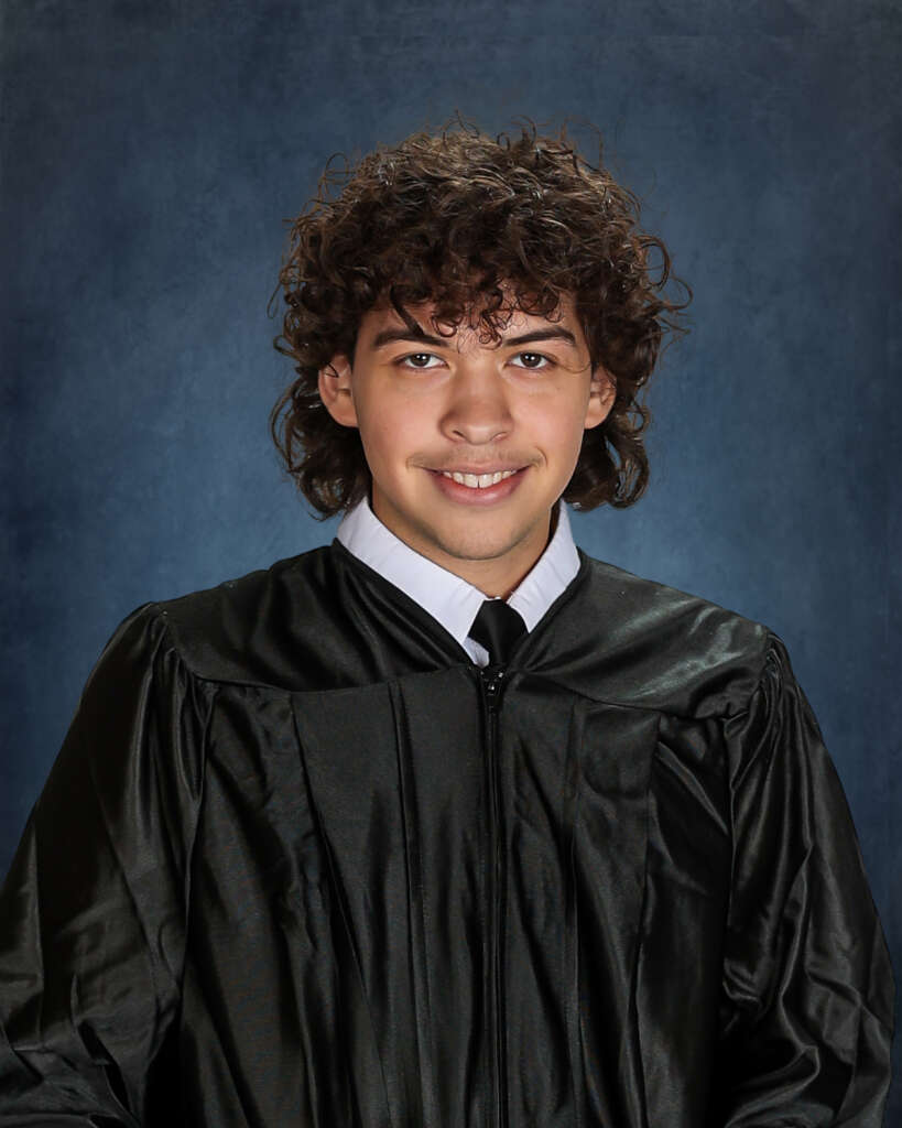 Graduate in cap and gown - KM Fine Photography